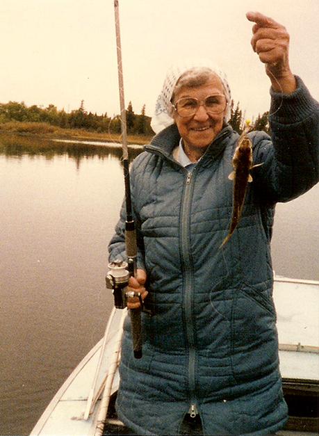 Proud of her catch in Aroland, Ontario