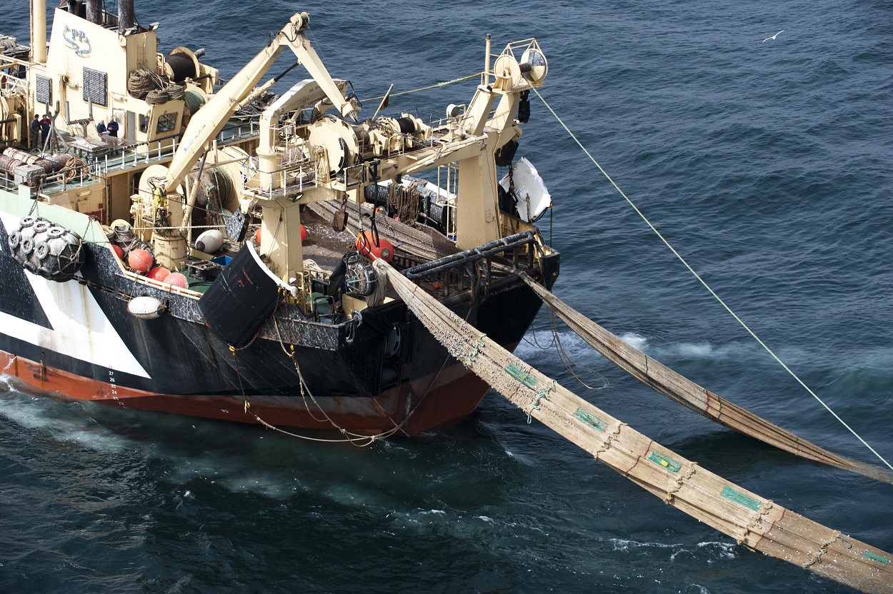 Trawler Ship in the ocean with long nets