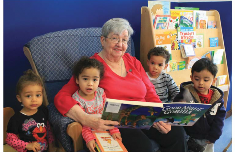 Associate Jean Fredricks with children at Caroline House