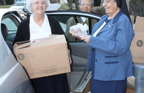 Sister Virginia Brien donating clothes