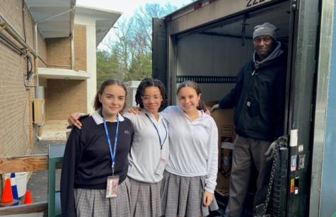 Lucia McClure of Wyckoff, Amaris Hiatt of River Vale, and Anna Daniello of Upper Saddle River brought their turkeys to Keith Owens from the Community FoodBank of New Jersey.