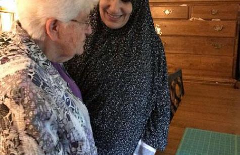 Sister Leonora Tucker converses with the mother of five children from Syria who has found refuge with SSND. 