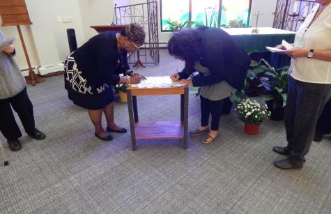Associates Rochelle Sims and Margarita Silva renew their covenants photo of associates lighting candles