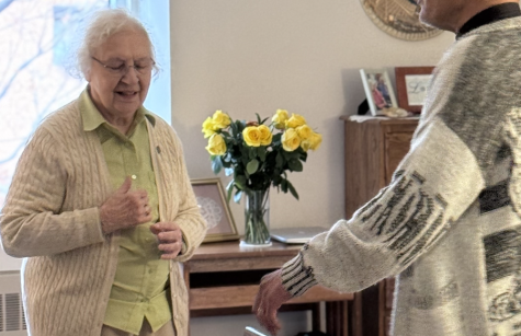 Father Gaddy blesses Sister Bernice Feilinger's room