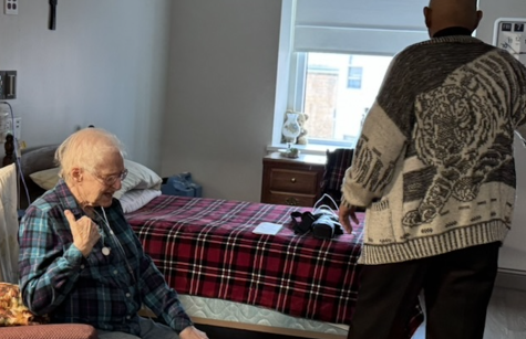 Father Gaddy blesses Sister Francita Hobbs's room