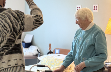 Father Gaddy blesses Sister Mary Frances Angermaier's room