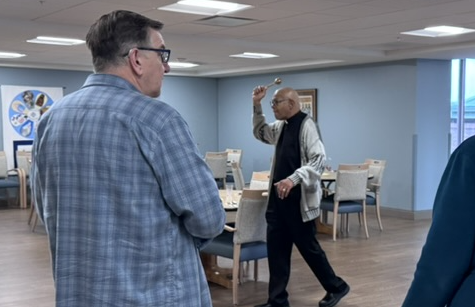 photo of Father Gaddy blessing community room