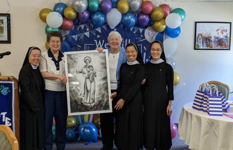 Sisters Charmaine Krohe and Marianne Roderick, local leader, were presented with a framed picture of Our Lady of Vietnam.