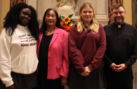 Photo of Sister Rebecca Tayag with Saint Saviour students and Father John Cush