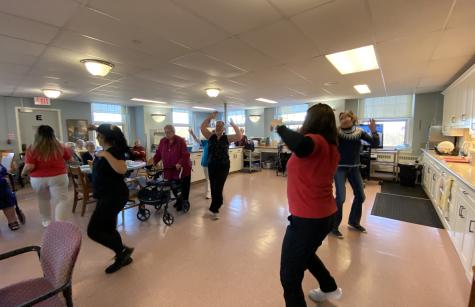 Staff and sisters flash mob dance